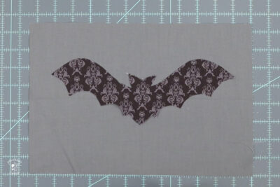 bat shape on gray fabric
