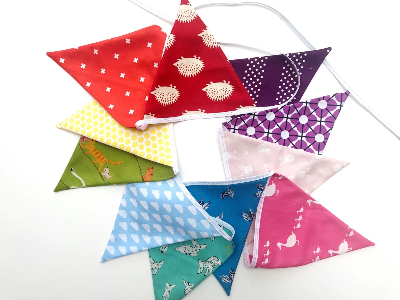 rainbow flag bunting on white tabletop