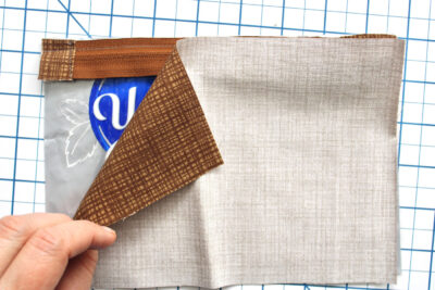 Zipper and fabric on cutting mat