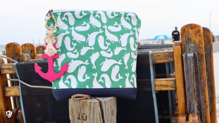 green nautical zip bag on beach