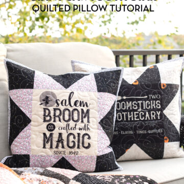 two black and white pillows on couch outdoors with halloween quilt
