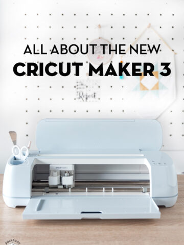 new cricut maker 3 machine on wood table in front of white wall