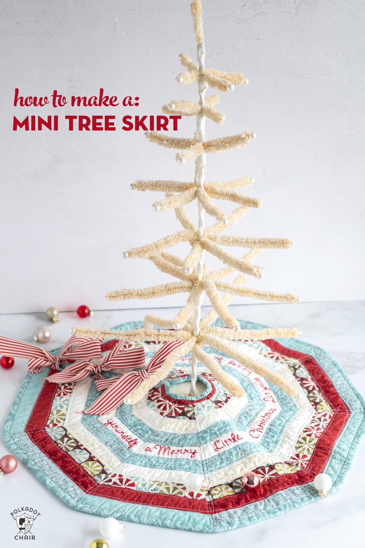 striped mini tree skirt on white marble table with white feather tree