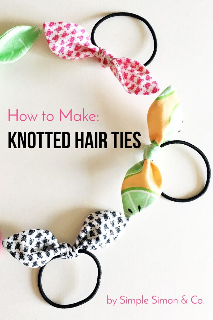 knotted hair ties in various colors on white table