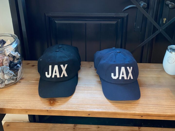 Two hats with JAX lettering