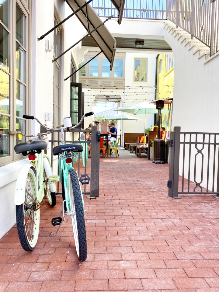 Two bikes parked near gate in beaches town center