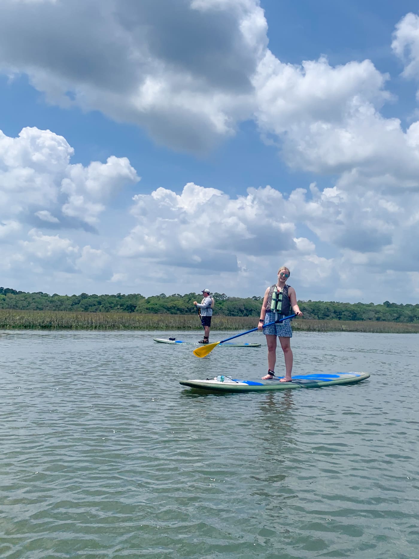 two people on paddleboards in water