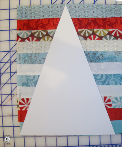 strips of sewn fabric cut on white cutting table