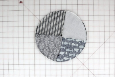 fabric circles on white cutting mat