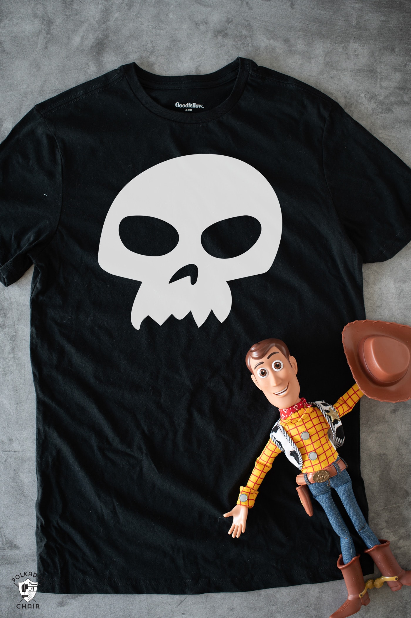 black t shirt and toy story woody doll on table